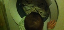 baby transfixed by the washing machine