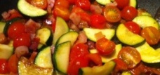 picture of bacon, courgette, tomato sauce in pan